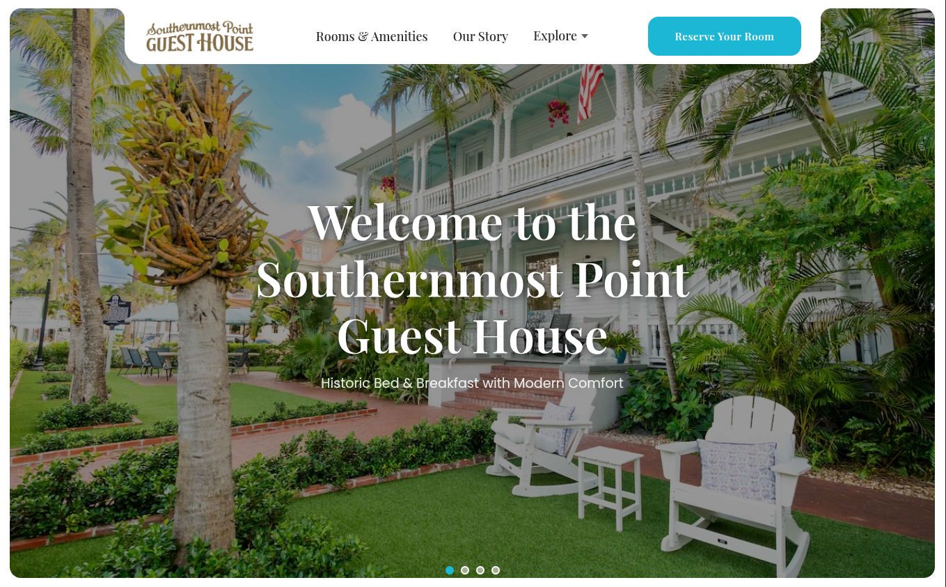 Southernmost Point Guest House homepage showing the historic guest house and garden